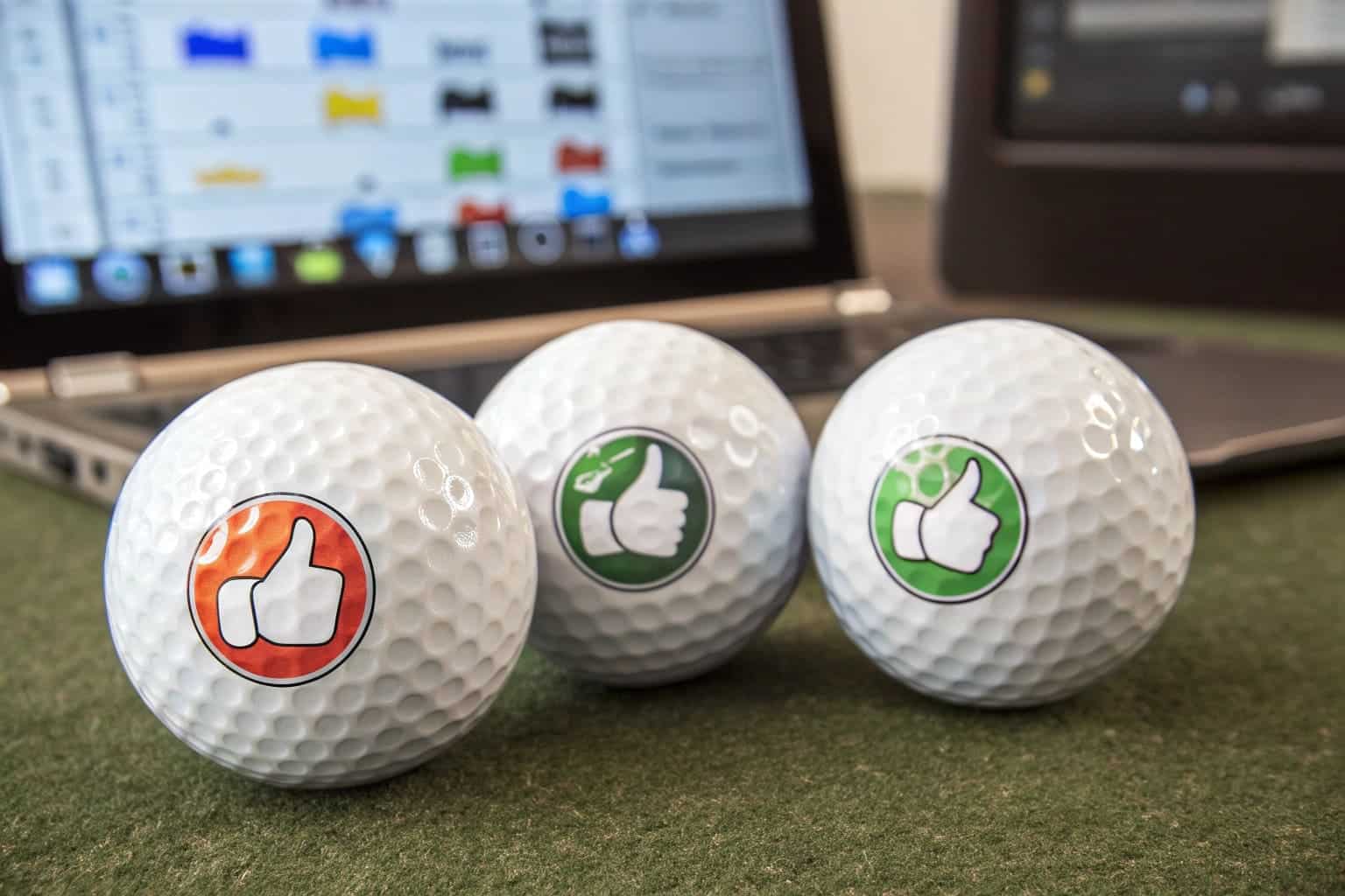 custom printed golf balls with thumbs up icons