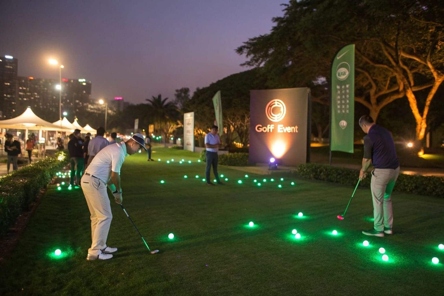 golfers playing with glowing balls at night event