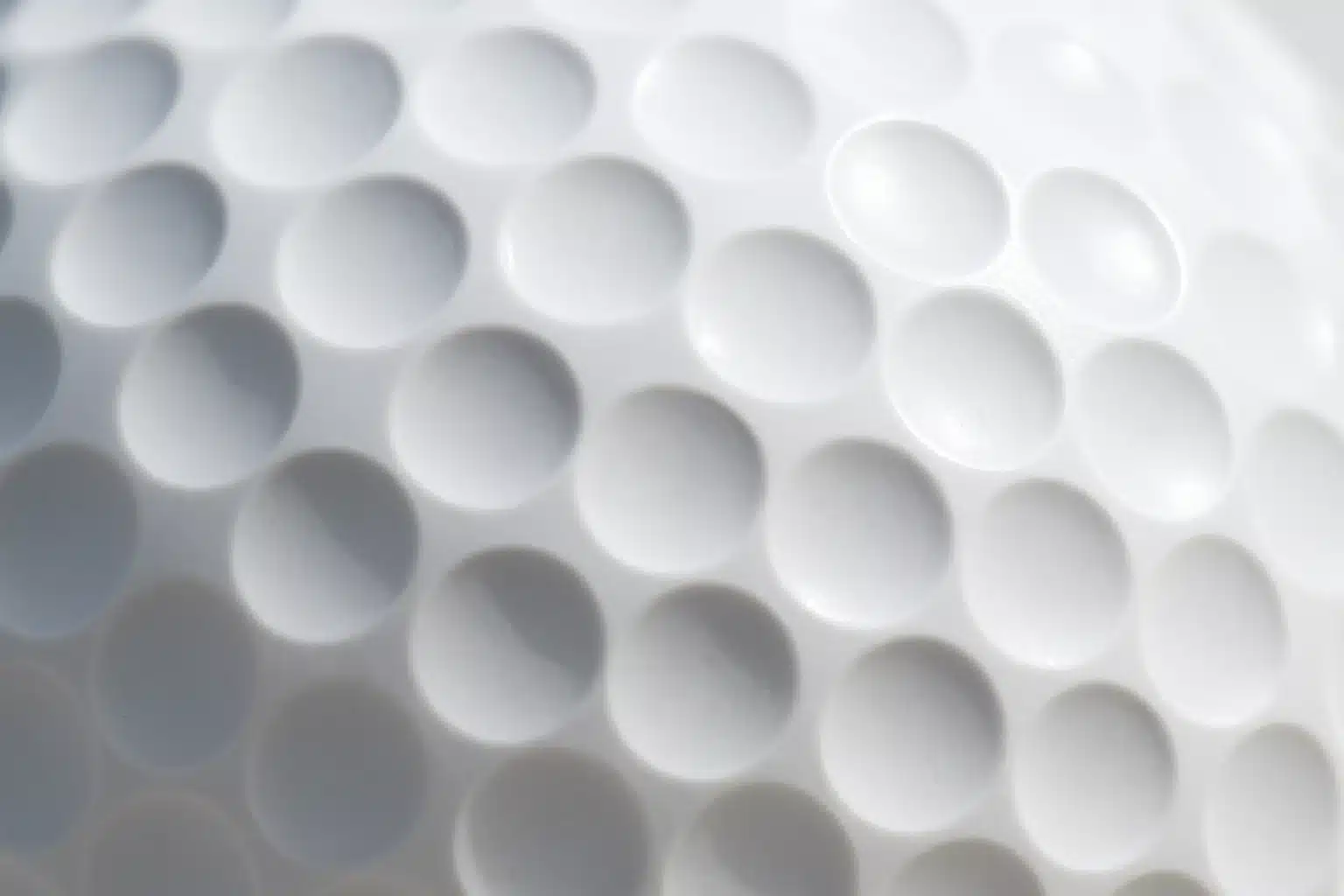 close-up of golf ball dimples showing surface texture and aerodynamic design