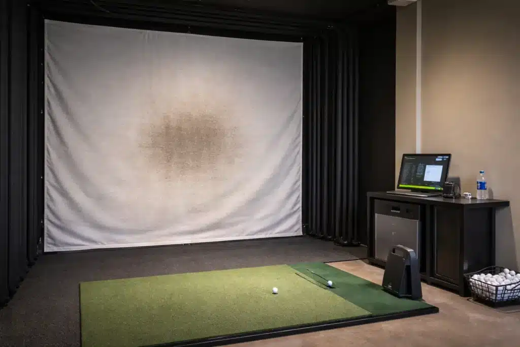 golf balls in indoor simulator bay for golf training and golf gear
